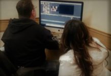 Social media strategies for building any career A man and woman sit in front of a computer monitor, looking at their social media strategies.