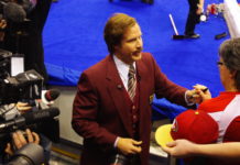 Olympic curling throwback: Commentary about Ron Burgundy commentary Fictional news anchorman Ron Burgundy, played by Will Ferrell, is wearing a burgundy suit jacket and signing autographs for fans at the Olympic curling trials in Winnipeg.