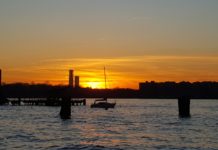 Walking around Manhattan: West Side story Photo of a beautiful sunset along the Hudson River, with silhouette of moored sail boat. Taken while walking around Manhattan.