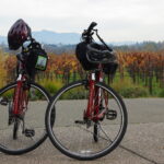 Got fitness goals? Pick your program and go for it Two road bikes with helmets on the handlebars are parked side by side on a country road, with a sprawling field in the back. Riders pursuing fitness goals.