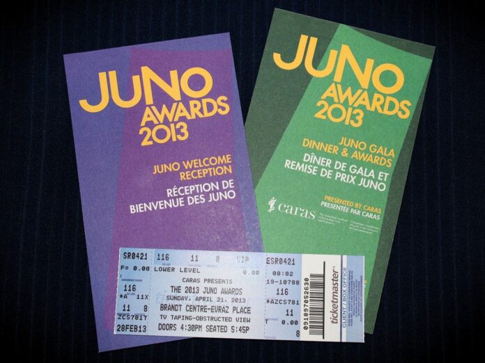 Close up shot of tickets - one is green, one is purple - to the JUNO Awards reception, and Gala Awards. As well as one standard-looking ticket for the television show.