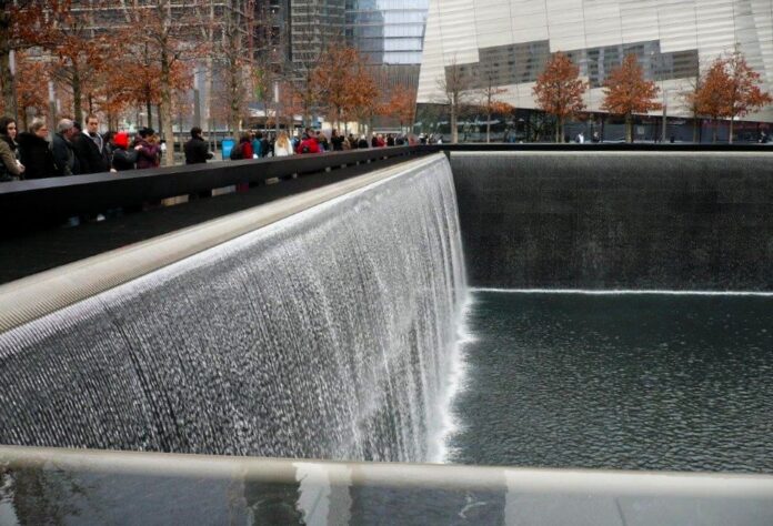 Sideways view of a waterfall at the 9/11 Memorial in downtown Manhattan, at the siter of the former World Trade Center.
